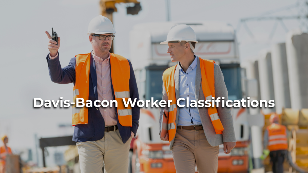 Construction supervisors reviewing Davis-Bacon worker classifications and wage determination requirements on a federally funded construction project.